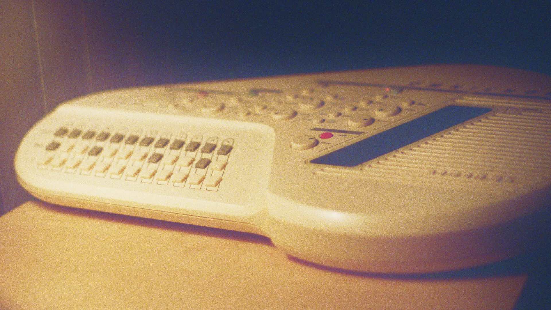 A moody photo of a Suzuki Omnichord OM300