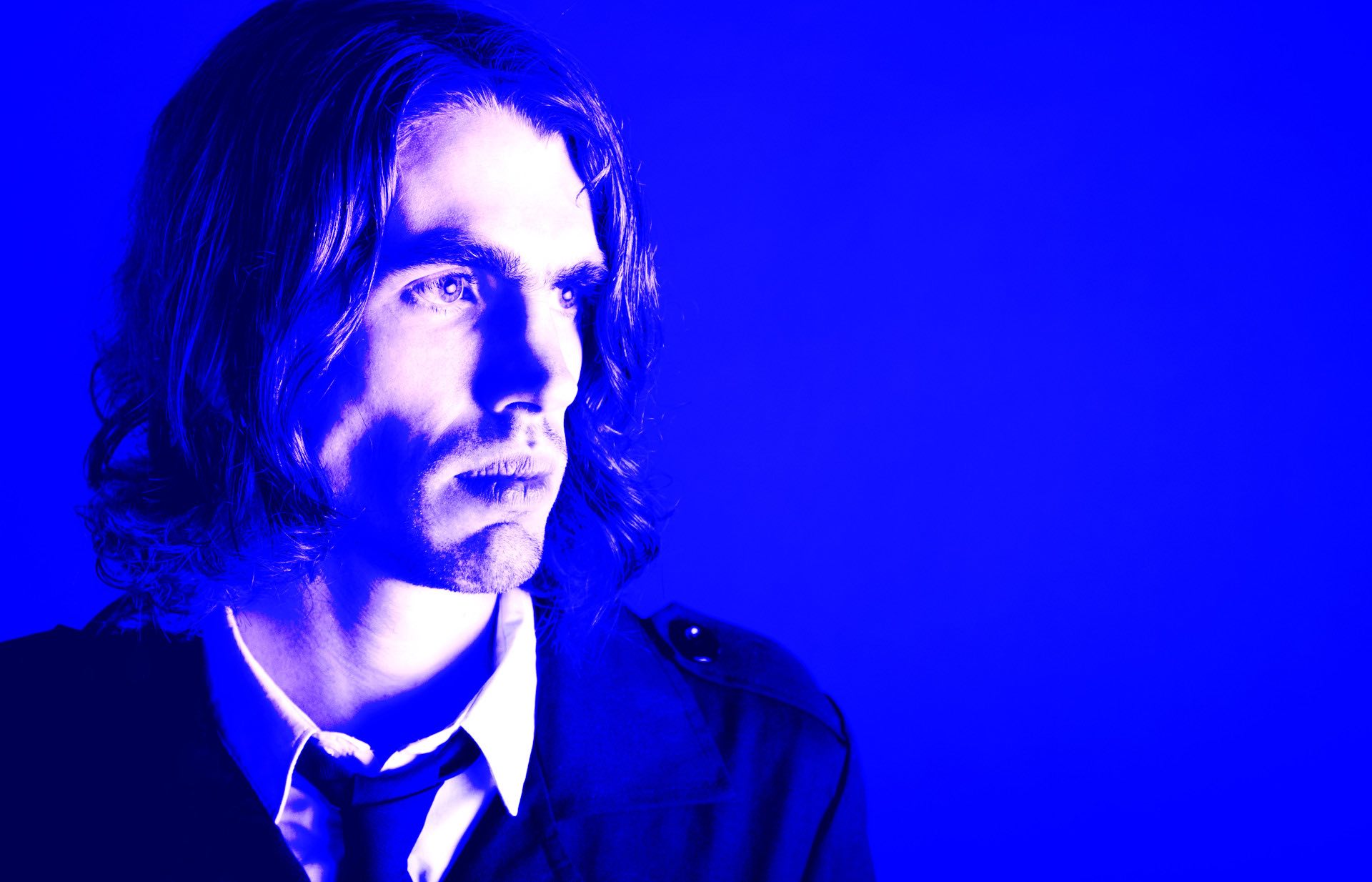 Alfonse blue Alfonse looking to the right against a blue background