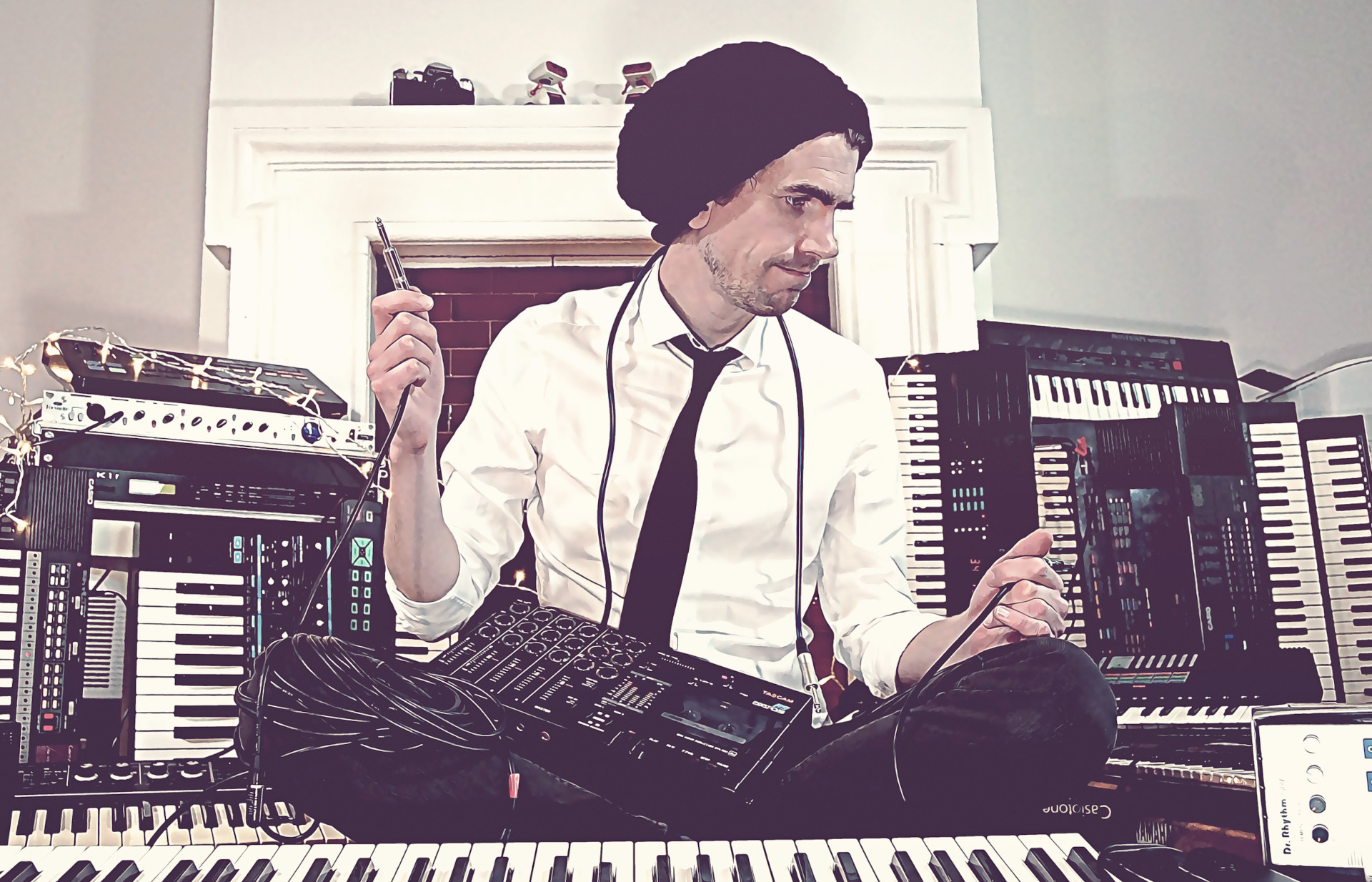 Alfonsekeys Alfonse surrounded by musical equipment and cables, looking unsure of what to plug in where