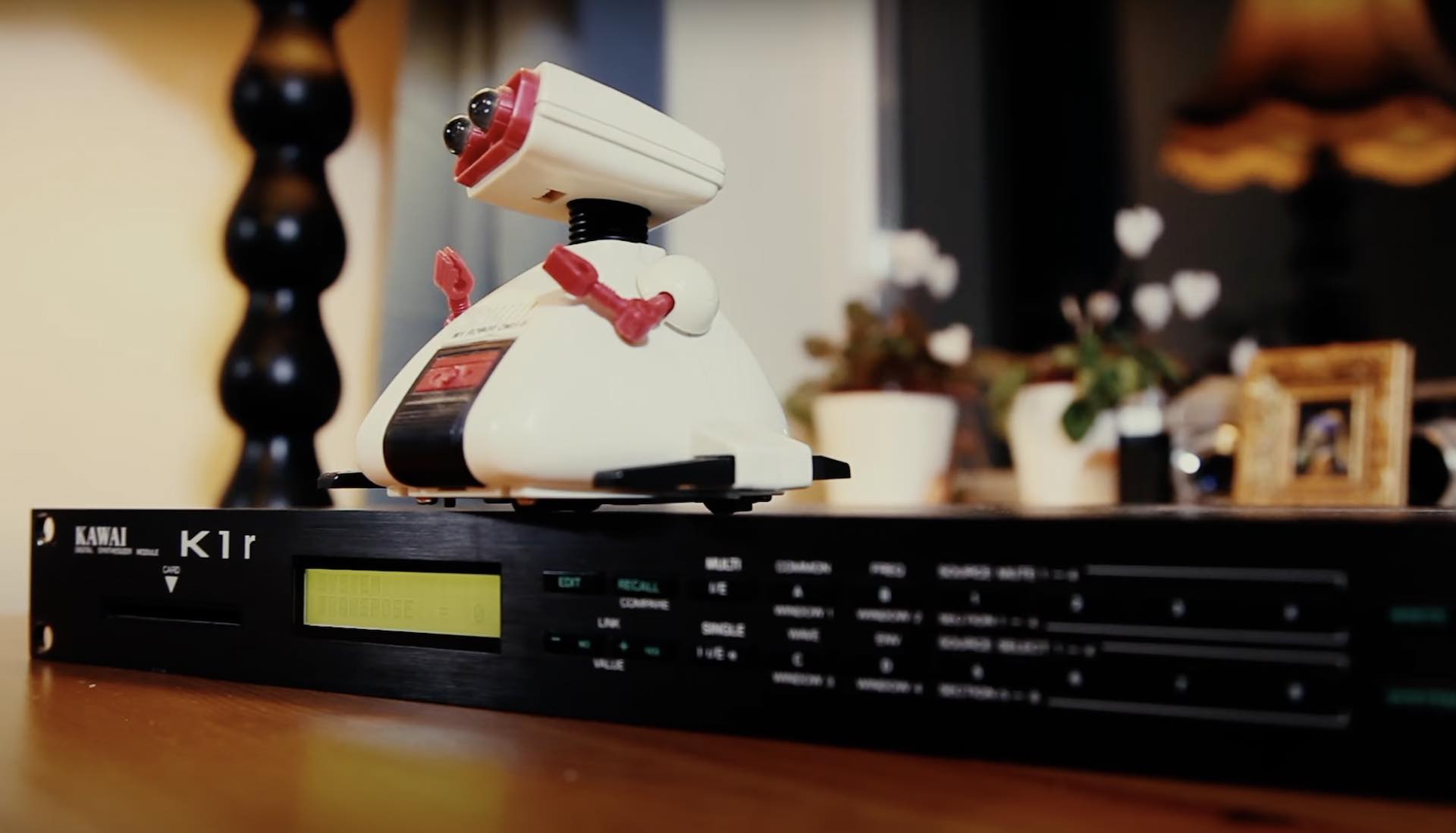 Kawai K1 synth module with a toy robot on top