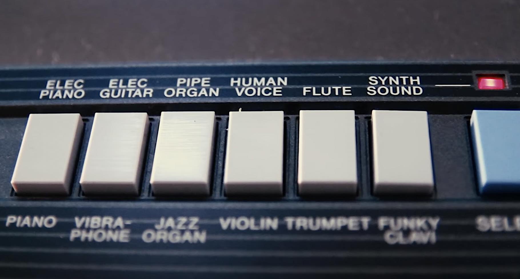 Close-up of sound selection buttons on a Concertmate 660 keyboard, including flute, synth sound, and human voice presets