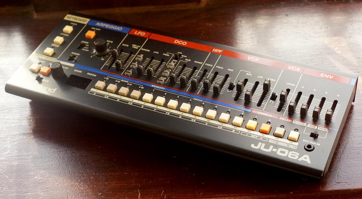 A Roland JU-06a Boutique synth module on a windowsill